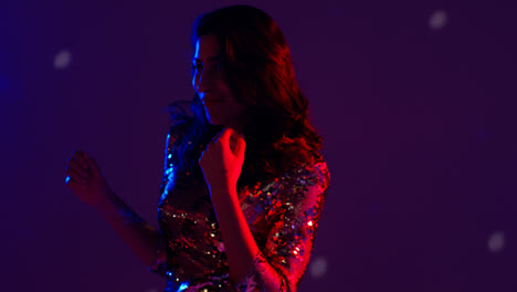 Close-Up-Of-Woman-In-Nightclub-Bar-Or-Disco-Dancing-With-Sparkling-Lights-10